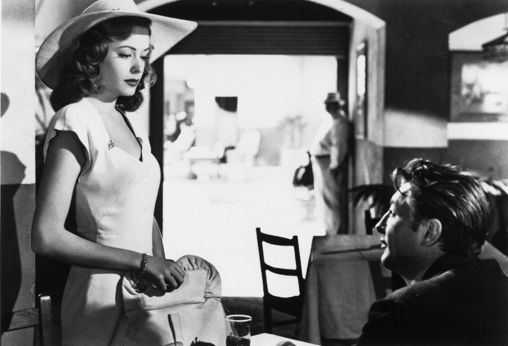 out-of-the-past-1947-005-jane-greer-in-white-standing-over-robert-mitchum-in-restaurant-00n-zcc-ORIGINAL.jpg